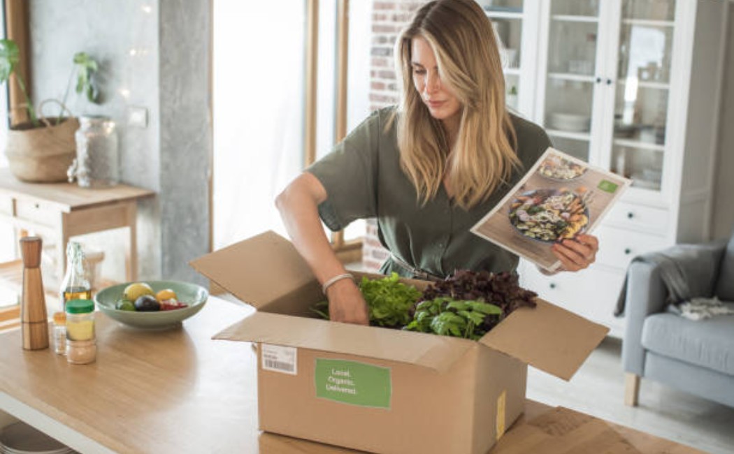 Woman receiving a package for professional unpacking services