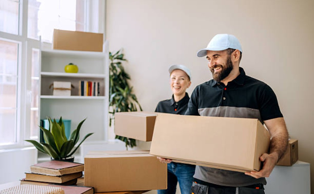 Unpacking services team handling boxes in a home move