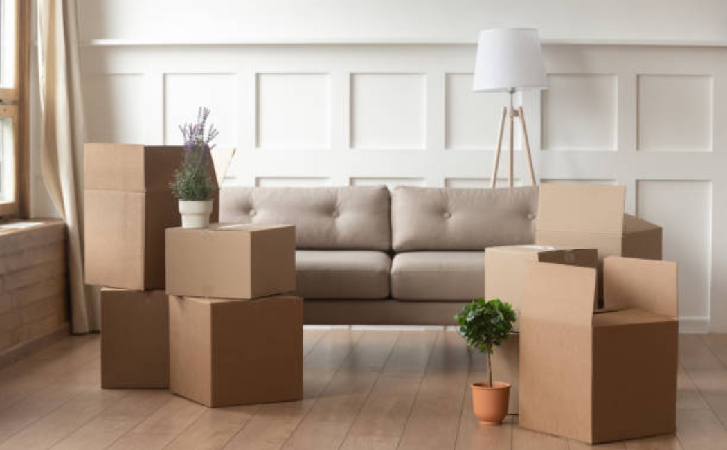 Unpacked moving boxes in a spacious home interior.