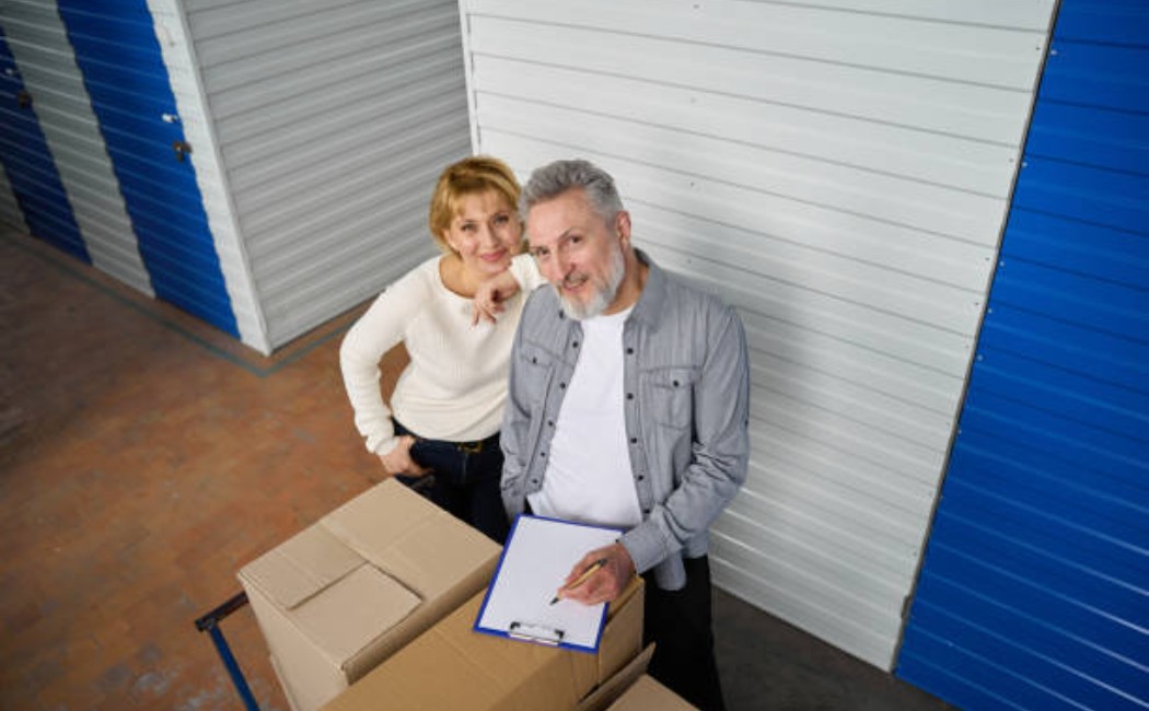 Man reviewing storage items and taking notes.