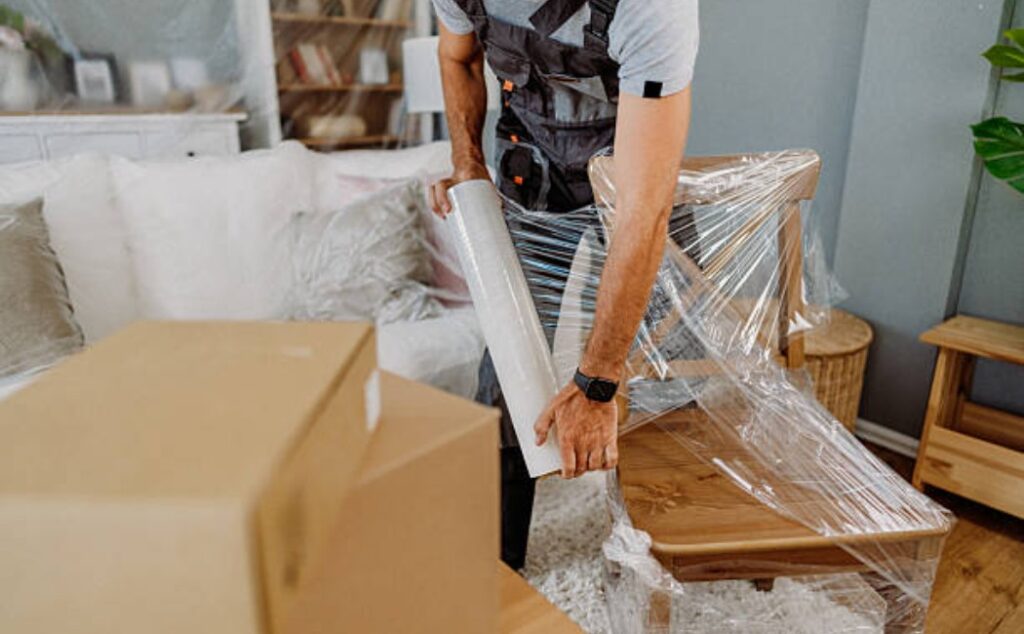 Family Packing boxes into the new home entrance.